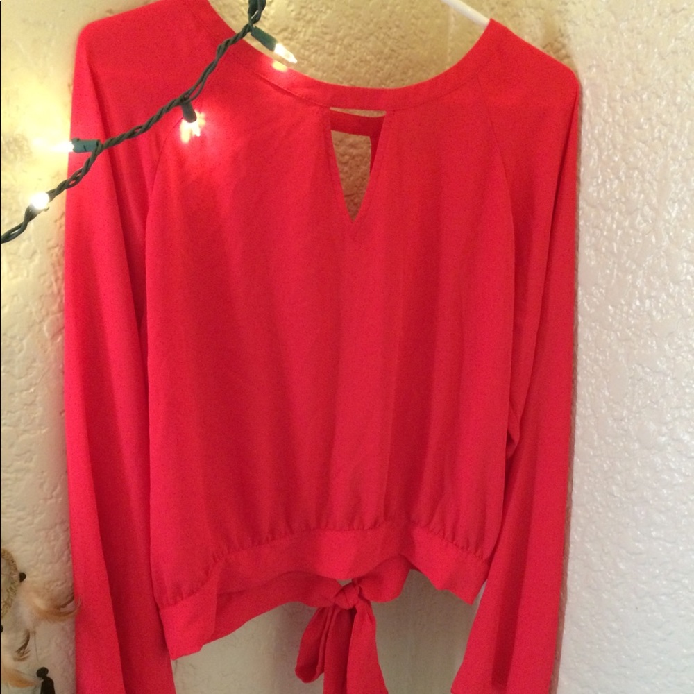 Reddish orange open back ties in back long sleeve
